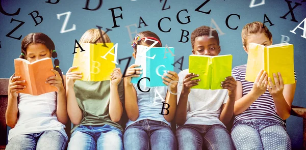 depositphotos_84427520-stock-photo-children-reading-books-at-park